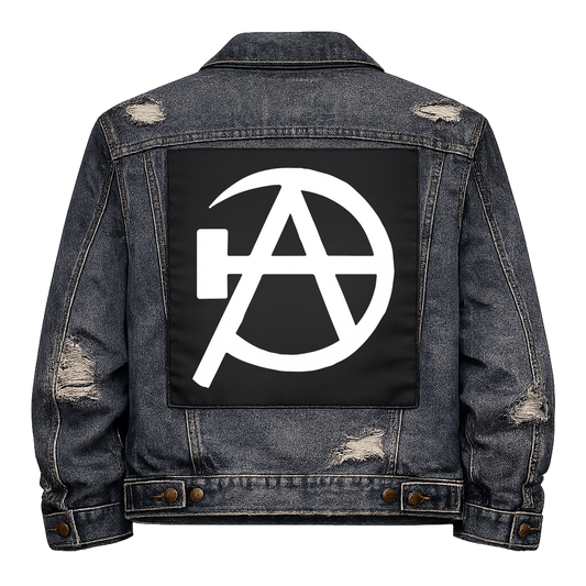 Black fabric back patch sew onto a denim jacket with the design "Anarcho Communism"